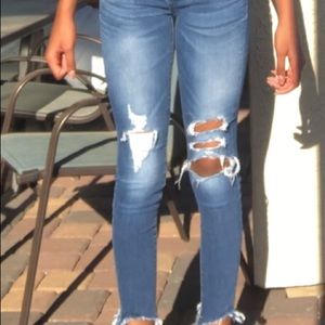 Low-waisted ripped jeans